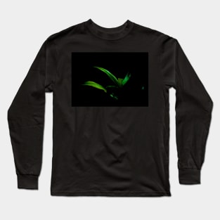 Bright green palm frond caught in sun against black background Long Sleeve T-Shirt